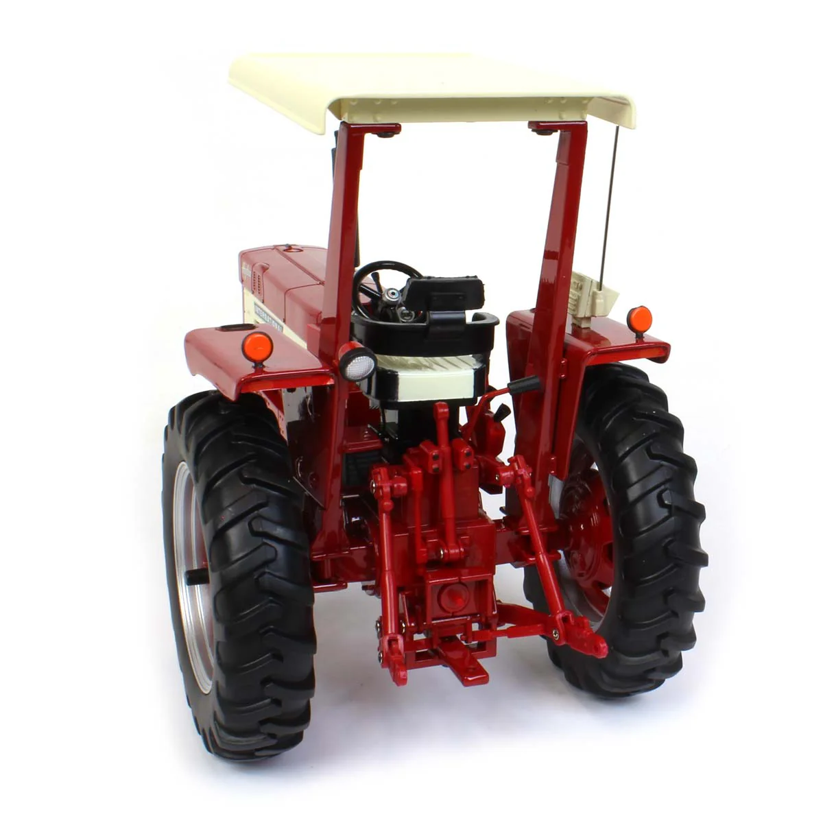1/16 International 666 Hydro Tractor with Narrow Front, ROPS, & Fender Radio, ERTL Prestige Collection - Image 5