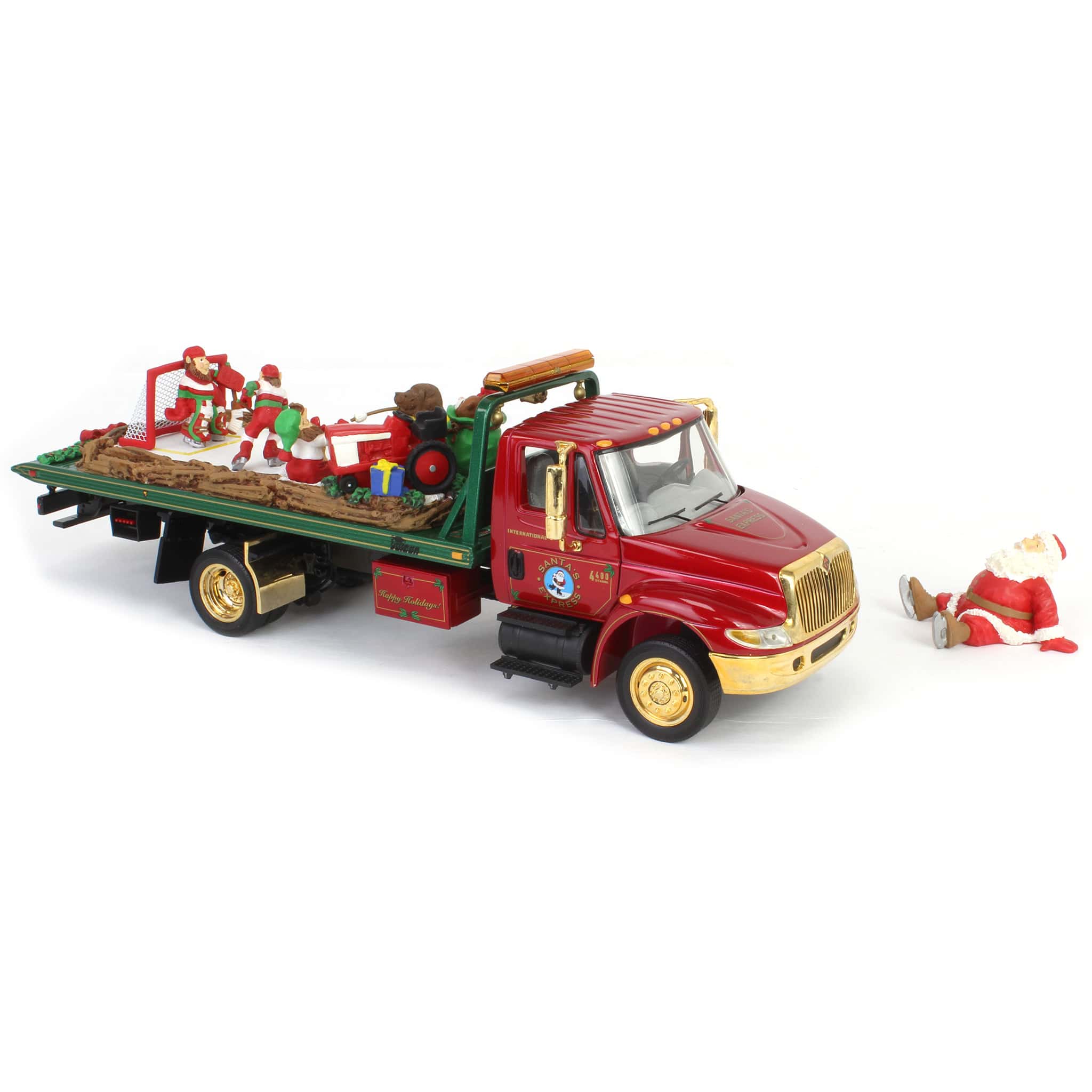 1/34 International 4400 Rollback with "Santa's Express" Cold Cast Load by First Gear - Image 2