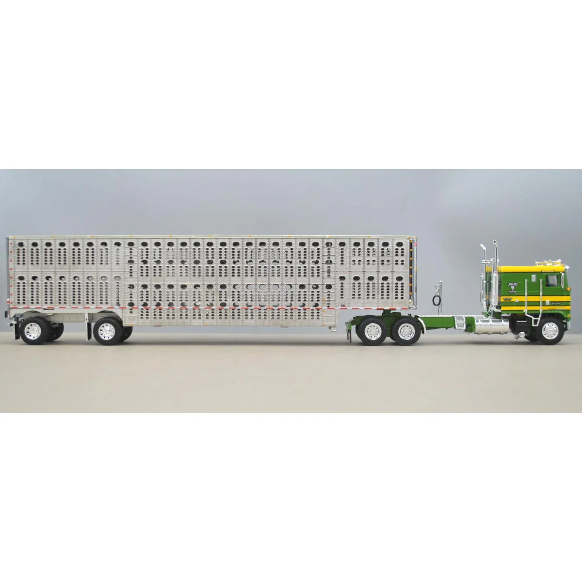1/64 DCP Green & Yellow Kenworth K100 Long Frame with Wilson Livestock Trailer, Hilton Trucking