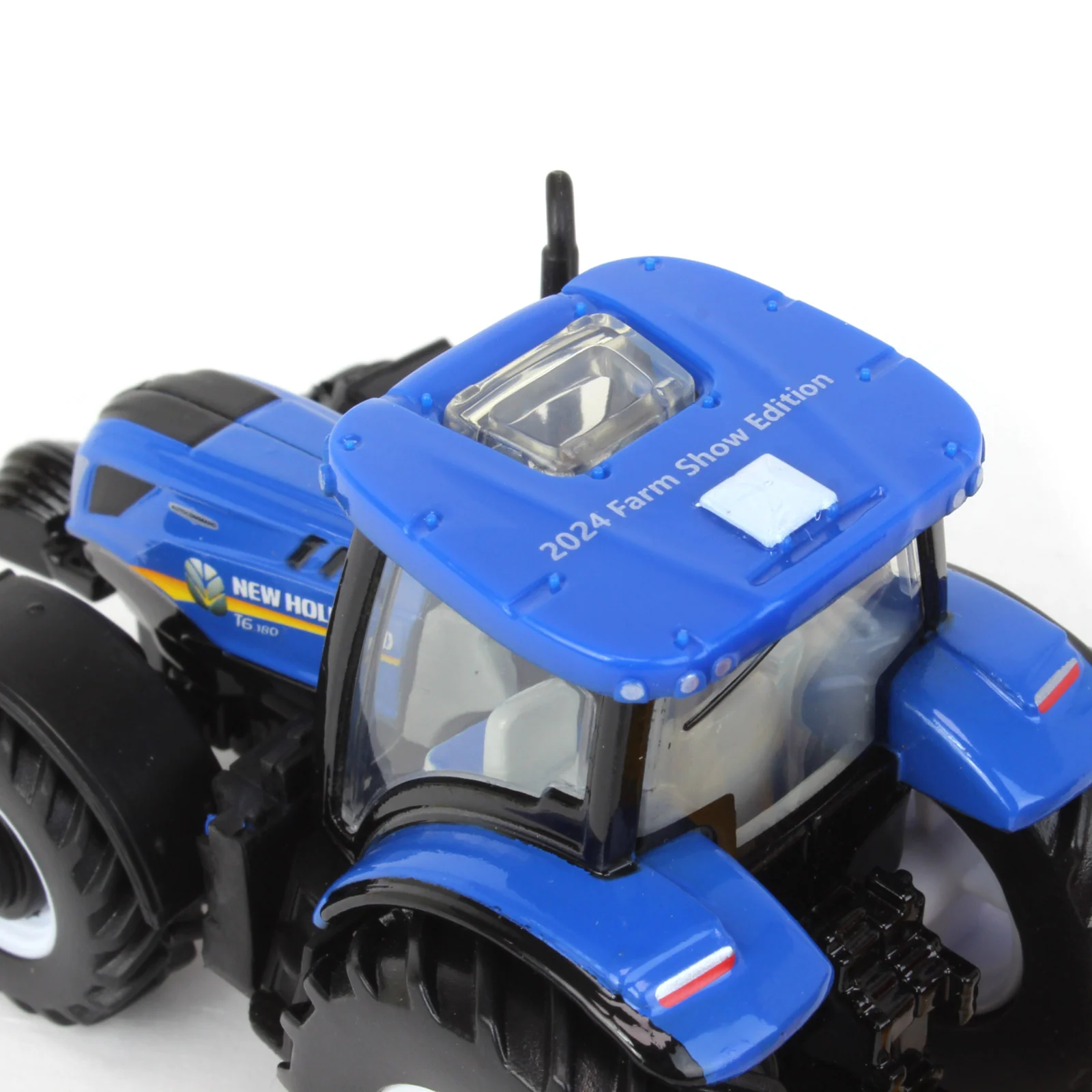 1/64 New Holland T6.180 Tractor with Roll-Belt 560 Round Baler & 6 Bales by ERTL, 50 Years Round Baling, 2024 Farm Show - Image 6