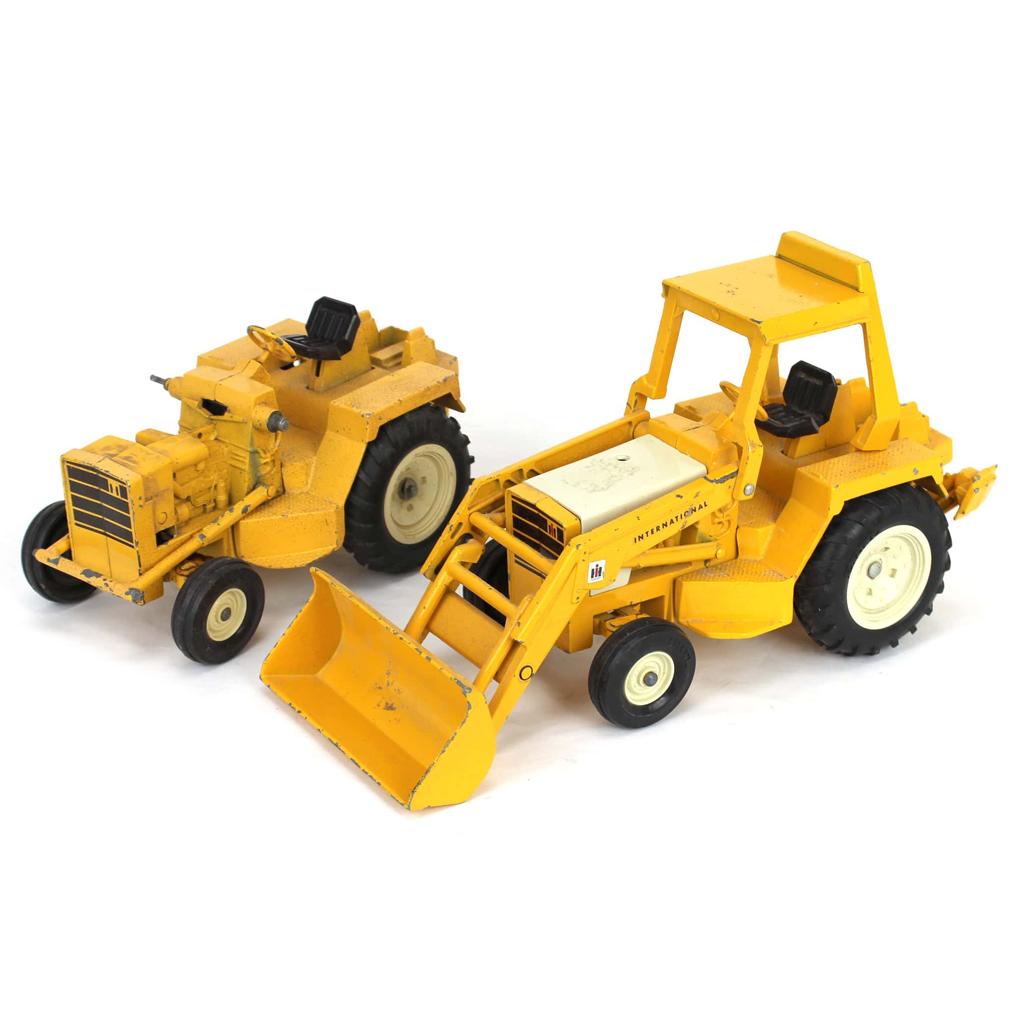 Lot of (2) 1/16 International Harvester Tractors and (1) Loader