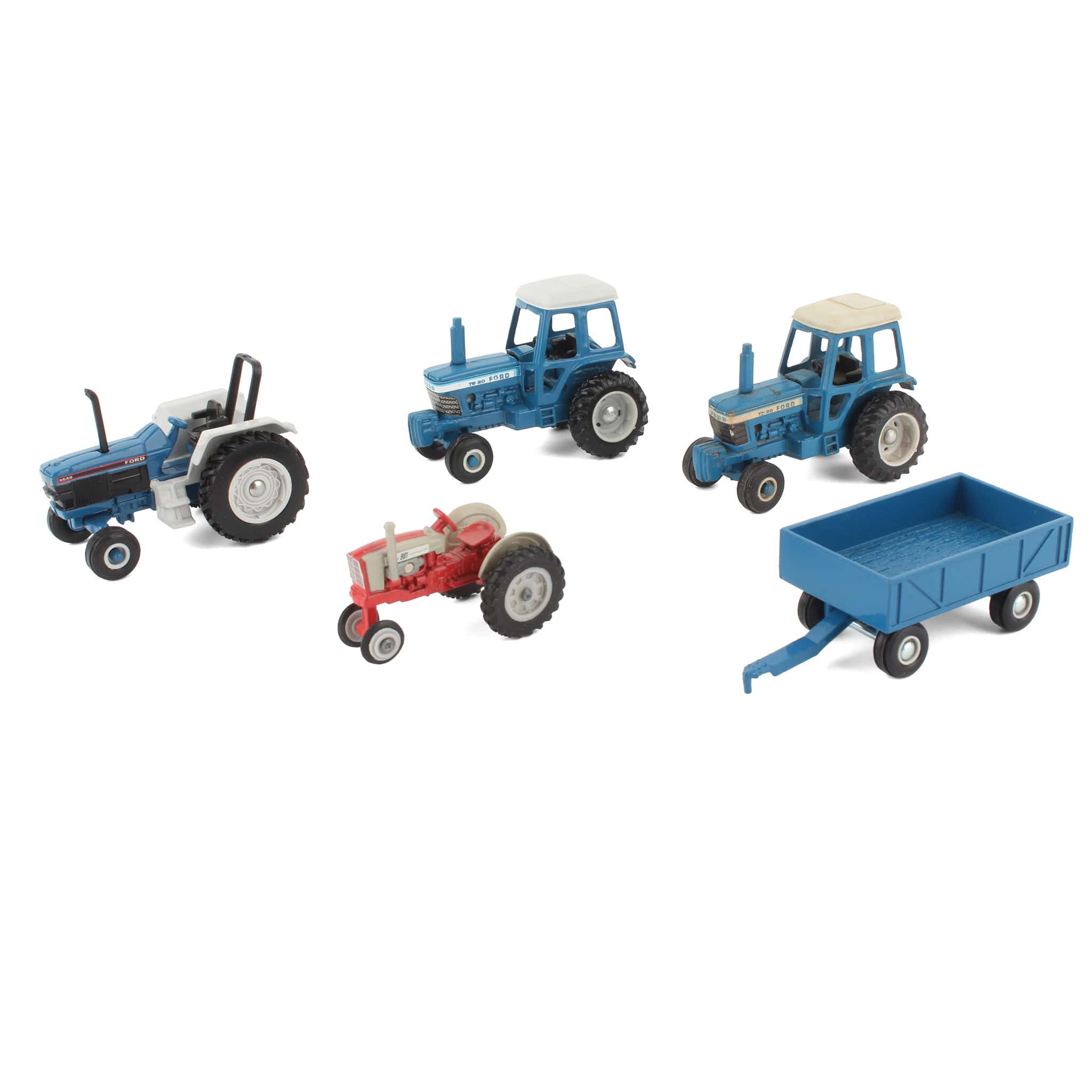 Lot of (4) 1/64 Ford Tractors and (1) 1/64 Blue Barge Wagon by ERTL